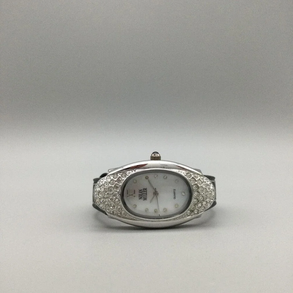Nolan Miller Womens Watch 22mm Silver Crystals Black Leather MOP Oval Dial